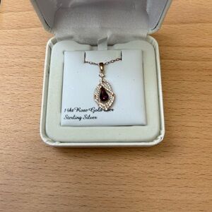 Rose gold necklace with dark purple stone